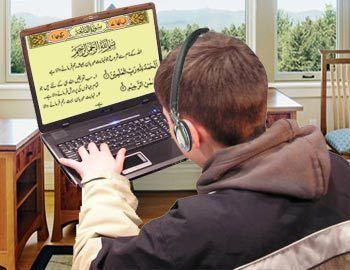 What Is Quran Reading Best For An over-the-shoulder horizontal photograph of a boy wearing headphones sitting in a room and looking at a laptop screen that displays Islamic scripture in Arabic with translated text, illustrating what is Quran reading best for.